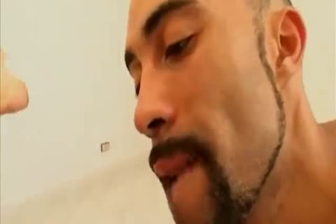 A pair of  arab dudes sharing a blond lad