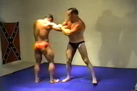 Athletic bodybuilder wearing heels fetish wrestling