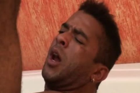 Two Tanned males poke