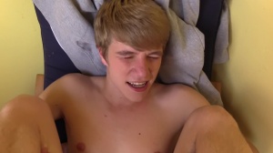 Czech lad with admirable blond hair nails in a park